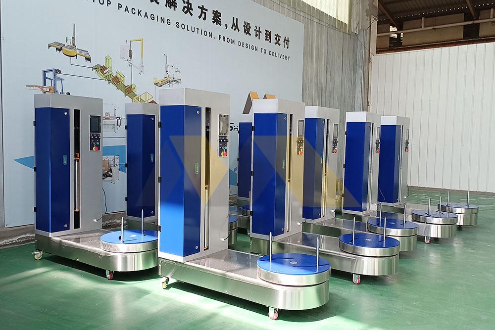 Maintenance technician repairing high-end European wrapping machine