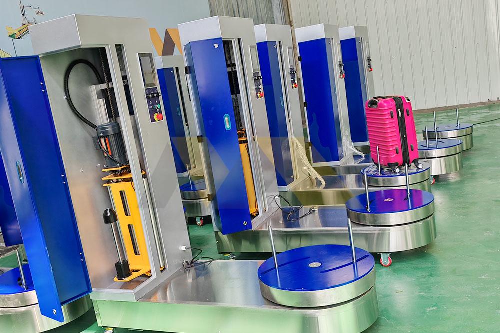 Industrial stretch wrapping machine wrapping boxes on a pallet