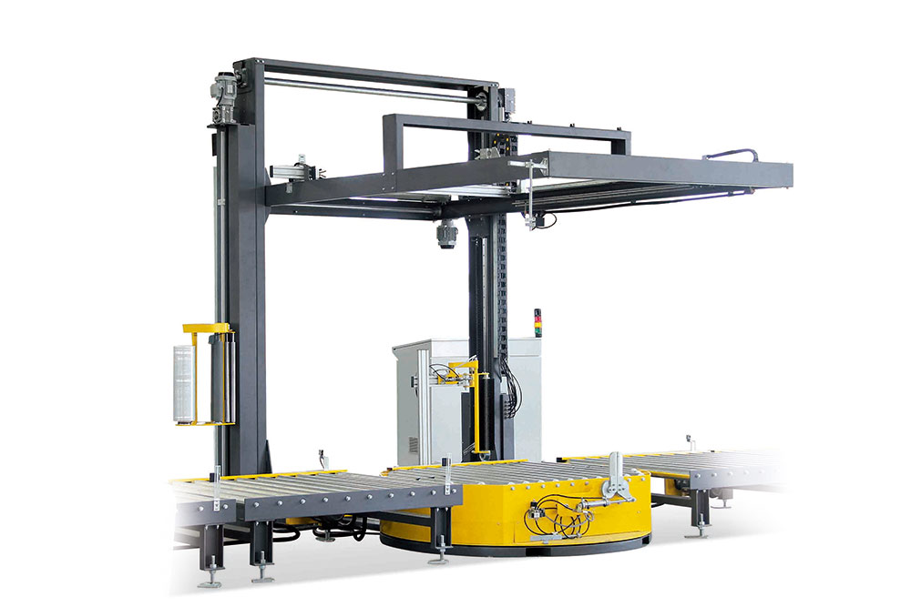 Robotic top film pallet wrapper sealing goods with stretch film.