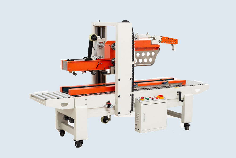 Industrial carton sealer applying adhesive tape for secure closure.