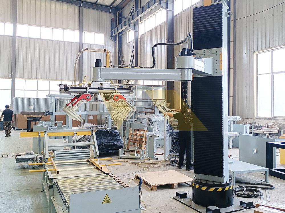 collaborative robot arm palletizer working alongside human operator palletizer machine