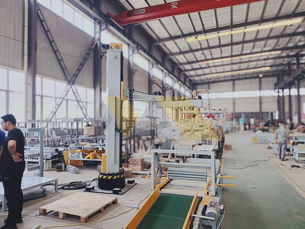 engineer inspecting column palletizer machine hydraulic components palletizer machine