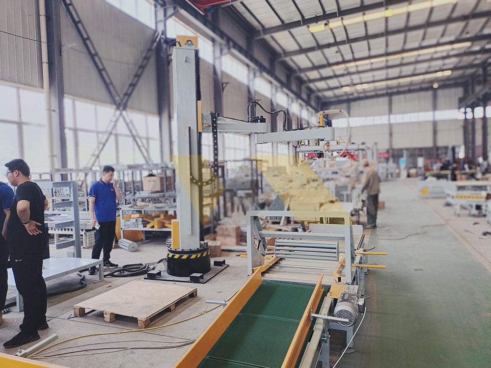 column palletizer machine stacking boxes in factory warehouse palletizer machine