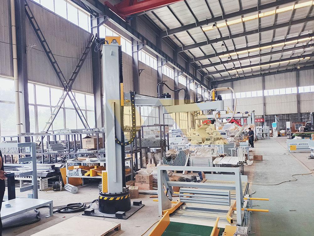 automated palletizer creating stable product loads in warehouse palletizer machine