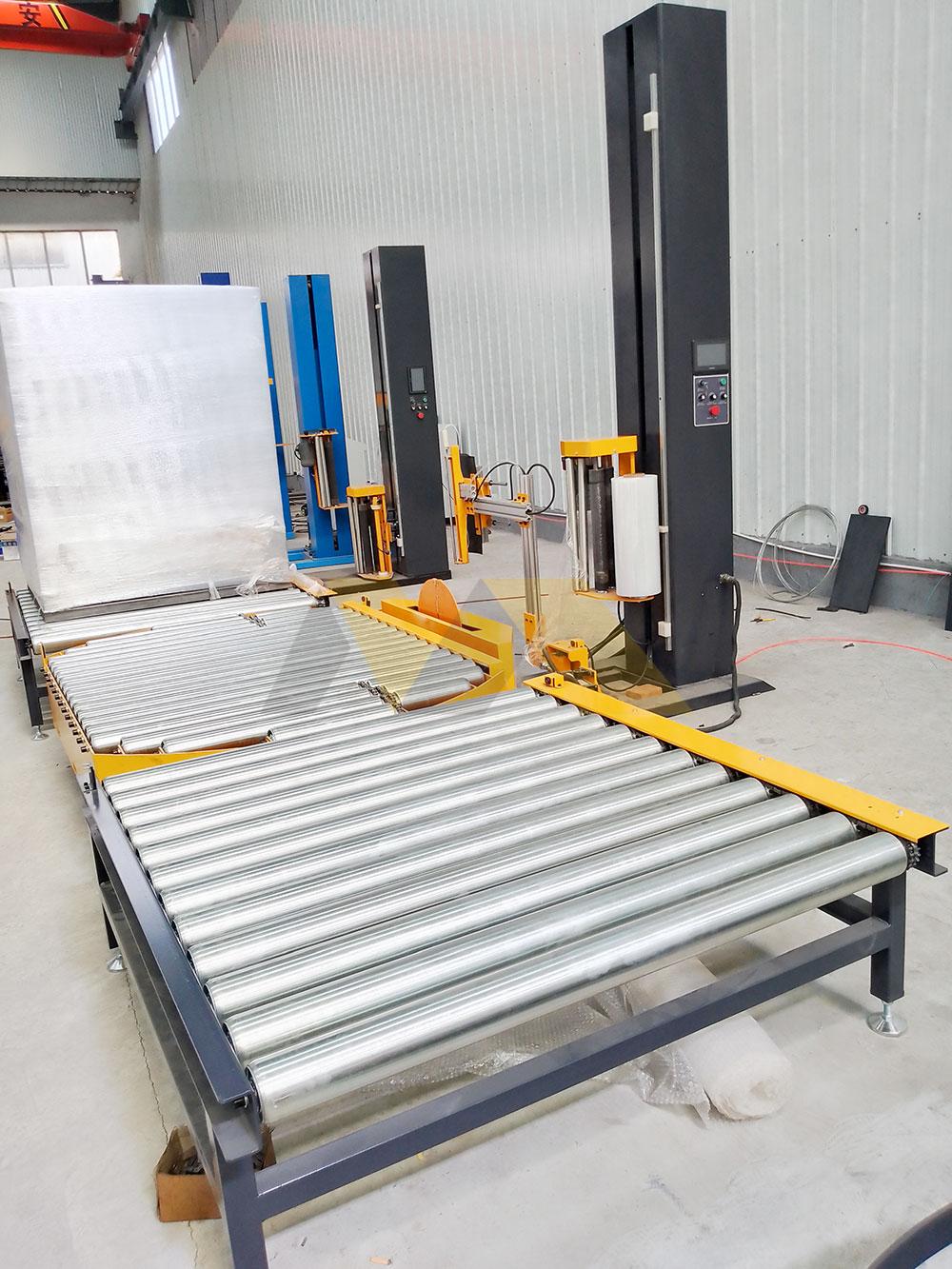 Engineer reviewing ISO audit reports on wrapping machine floor