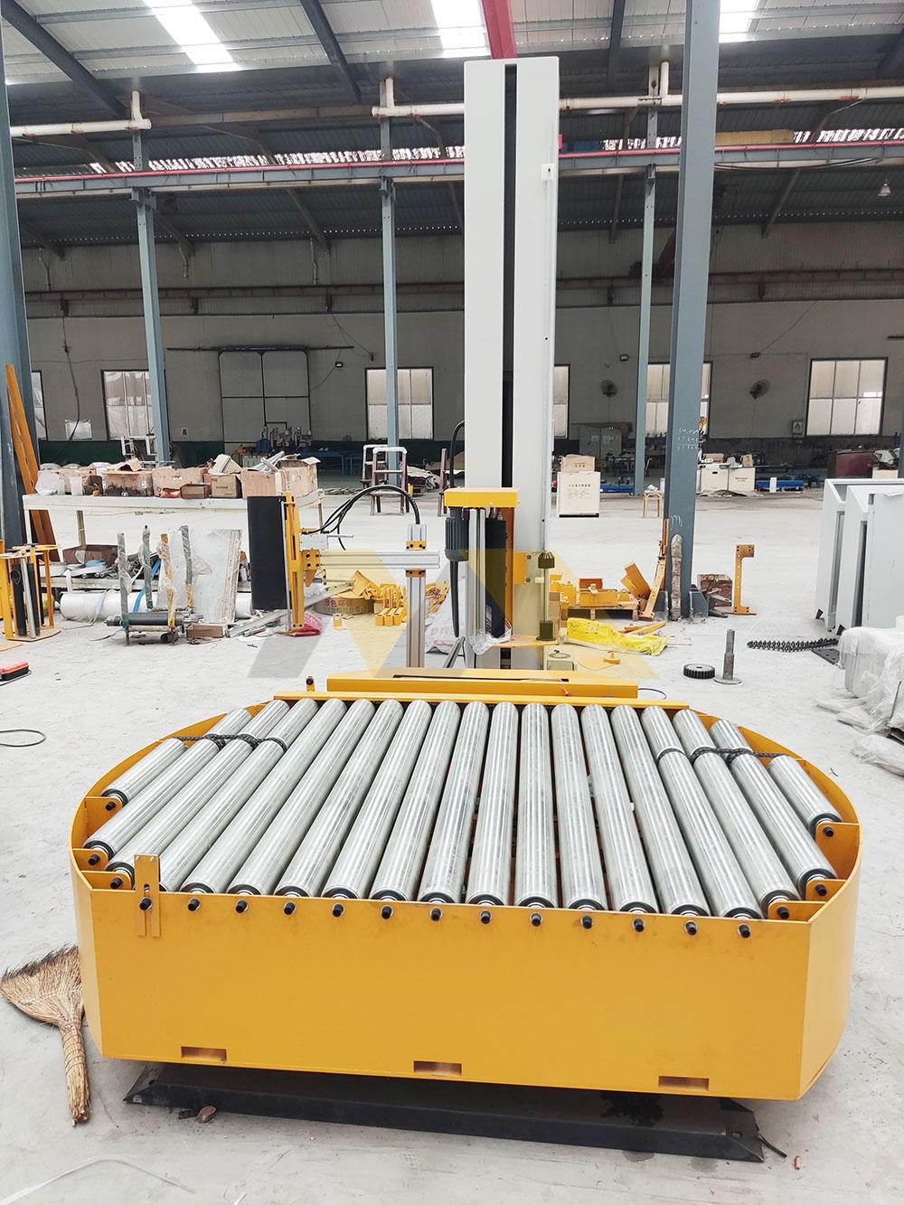 Warehouse manager frustrated by broken pallet wrapping machine