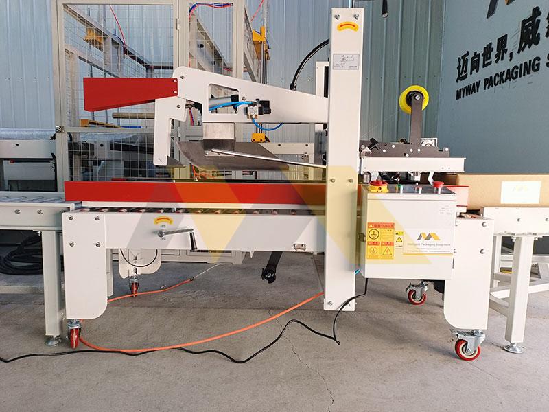 carton tape sealer mechanism