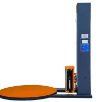 Industrial pallet wrapping machine stabilizing loads for secure logistics operations.